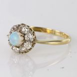 Yellow metal tests as 18ct Opal Ring with Diamond surround size O weight 2.3g