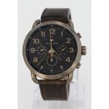 Gents Hilfiger chronograph wristwatch. The Black 46mm dial with gilt arabic numerlas along with