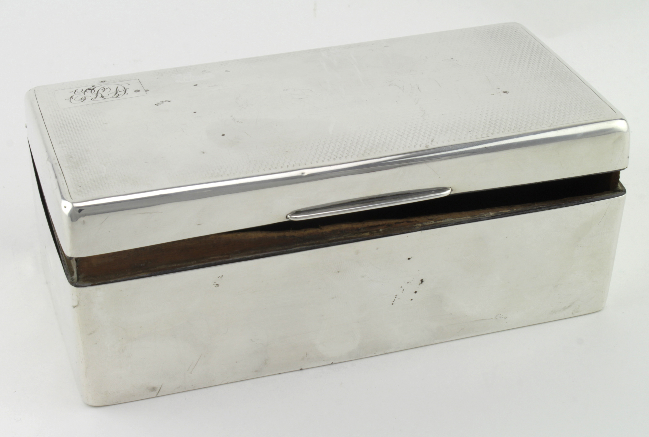 Silver cigarette box with a wooden interior which has some damage - silver hallmarks very rubbed and