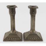 Pair of Victorian, Corinthian Column type, silver candlesticks (both have loaded bases). Stands 5.