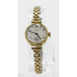 Ladies 18ct cased wristwatch by Longines (circa 1940). The cream 20mm dial with baton / arabic