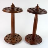 Stick Stands. A pair of cylindrical walking stick stands, each able to hold sixteen walking