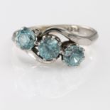 White metal Ring marked 9ct.Plat. Set with three Blue Zircons size M weight 3.4g
