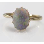 Yellow metal Ring marked 9ct set with large Opal doublet size L weight 2.5g