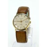 Gents 9ct cased quartz wristwatch by Garrard, the cream dial with arabic numerals and date