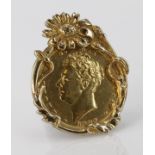 George IV Sovereign dated 1827 in an ornate hallmarked 9ct mount, total weight 11.5g