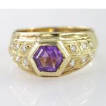 Yellow Metal marked 750 Amethyst and Diamond set Ring size N weight 7.9g