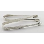 Two pairs of Georgian silver sugar tongs; one with bright-cut decoration; hallmarked SG, EW, IB. (