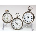Three silver cased fob watches.