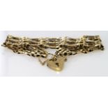 9ct gold five bar gate bracelet with safety chain, hallmarked London 1985, weight 12.3g