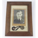 RAF WW2 framed bomb aimer portrait photograph with half wing and cap badge. (Buyer collects)