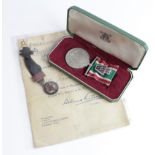 Order of the Red Triangle award document and Woman's Volunteers Service Medal in case to Mrs