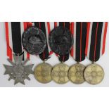 German Nazi medals - Merit Cross with Swords, Merit Medal x4, Black Wounds Badge x2. (7)