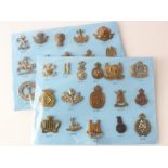 Cap Badges on a blue cards - Yeomanry badges all with K&K numbers. (31)