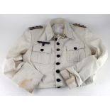 German WW2 Officer tropical tunic complete with epaulettes, breast eagle etc., some light age wear.