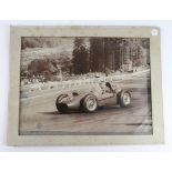 Mike Hawthorn racing Ferrari 16, a large sepia press photo, autographed in pen 'To Colin With Best