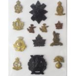 Cap badges etc - range of Canadian Military Badges on a card. (13)