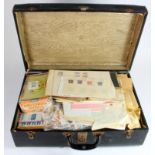 Black suitcase well filled with mostly pre 1970's stamps in packets, on album pages, club books,