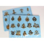 Cap Badges on a blue cards - Cavalry badges all with K&K numbers. (27)