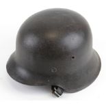 German WW2 M42 pattern raw edge helmet with traces of decal possibly SS complete with lining and