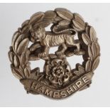 Badge Hampshire Regiment WW2 plastic economy hat badge complete with fixing lugs.