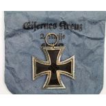 German Iron Cross 1939 2nd Class, no ribbon and packet of issue, maker marked '128'.