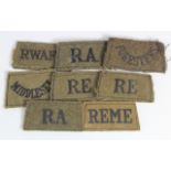 WW2 interest - 1939/1940 period Black-on-Khaki British Slip-on Shoulder Titles (8 items)