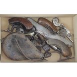 Box of vintage gun parts including hammers, wood grips, flint lock parts etc. (qty) Buyer collects