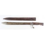 German WW1 saw back butcher bayonet with scabbard. Blade maker marked 'Packohliger & Co Solingin'.