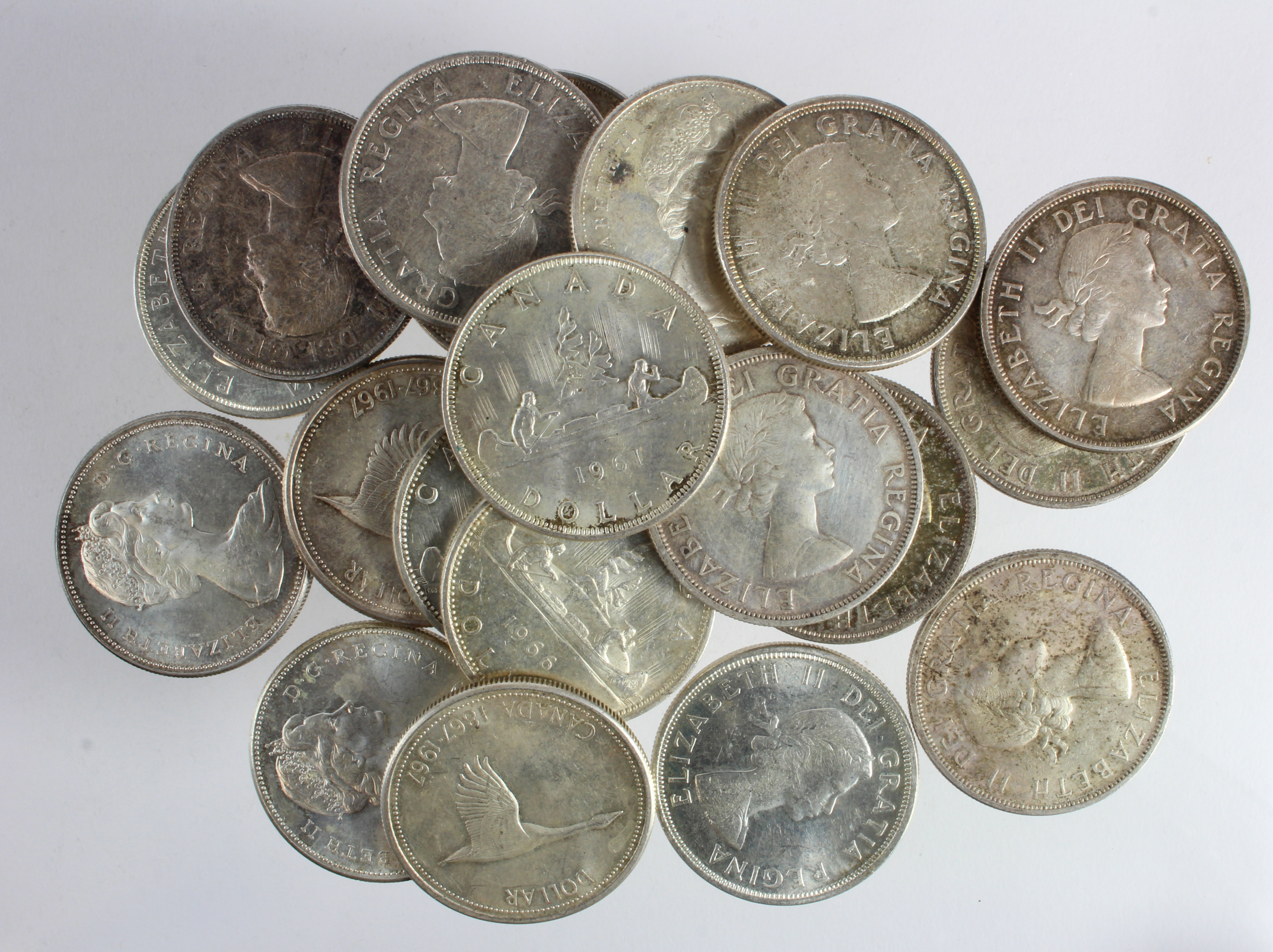 Canada Silver Dollars (20) 1958 to 1967, mixed grade.