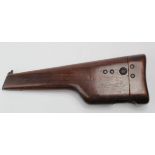 Wooden shoulder stock for the C-9 Broomhandle Mauser. Stamped 'Made in Canada' for U.S. Import