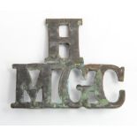 WW1 H.M.G.C Shoulder Title. This was for the Heavy Machine Gun Section Corps which was the very