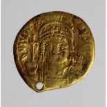 Byzantine Empire. Justinian I 527-565 A.D., gold solidus, which has had a hard life, wt. 3.14g.,