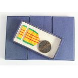 Vietnam War Unissued US Vietnam Service Medals in original boxes and wrapped in the original