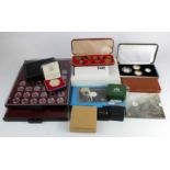 Assortment of GB silver proofs, small gold issues, sets etc along with two empty Lindner trays.
