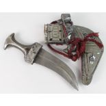 Oman Khanjar Dagger with horn grips, scabbard and handle decorated in silver.