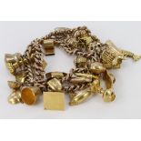 9ct curb double row charm bracelet with thirty assorted charms, weight 56.4g