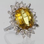 18ct white gold citrine and diamond cluster dress ring, oval citrine surrounded by round and