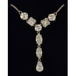 18ct white gold "Y" shaped diamond set necklace featuring eight diamonds of varying cuts. Two