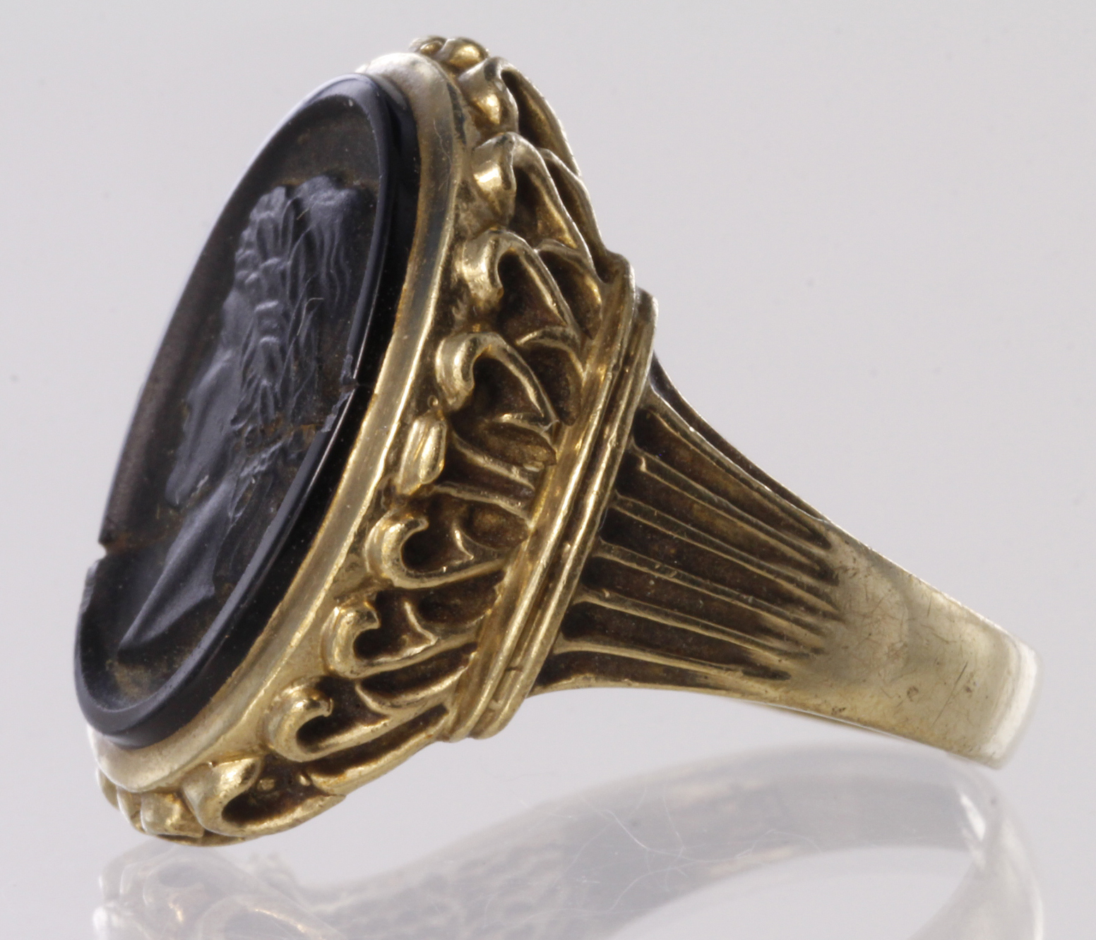 9ct dress ring set with oval jet carved to depict a Roman man, snapped ring shank and damage to jet, - Image 2 of 2