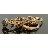 Six 9ct yellow gold assorted garnet rings, weight 10.8g