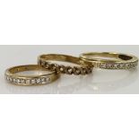 Three 9ct yellow gold diamond set half eternity rings, 5.7g