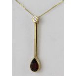 9ct hallmarked Gold Garnet set Drop Pendant on a fine 16 inch chain weight 3.3g