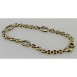 9ct yellow gold three row panther link bracelet with white gold spacer links and feature clasp,