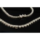 18ct white gold graduated diamond tennis style necklace consisting of eighty nine round brilliant