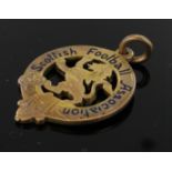 9ct Scottish Football Association pendant with rampant lion emblem, weight 8.6g