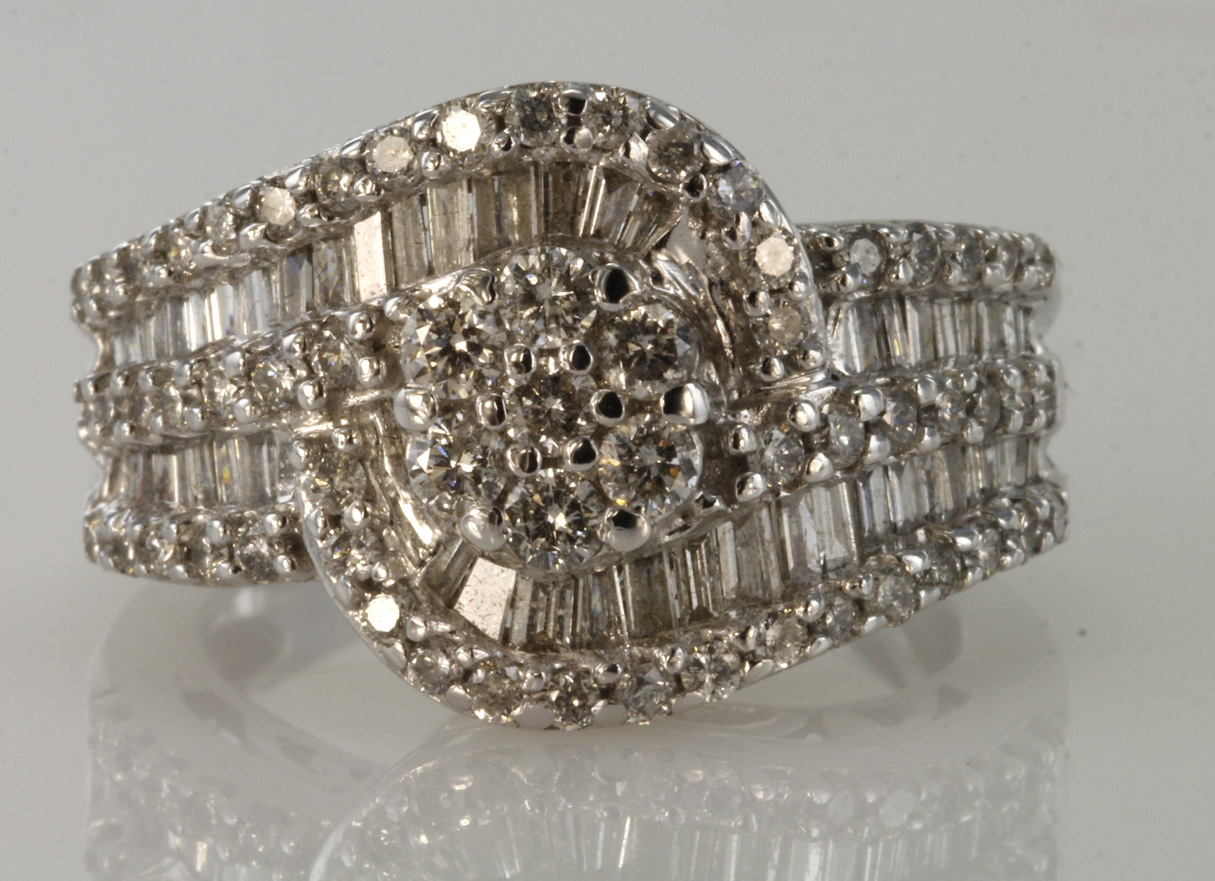 14ct white gold diamond cluster ring with central seven stone daisy cluster surrounded by a row of