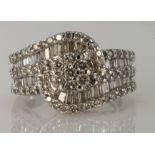 14ct white gold diamond cluster ring with central seven stone daisy cluster surrounded by a row of