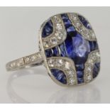 Platinum Art Deco style ring set with sapphire and diamonds. Cushion shaped ring head measuring