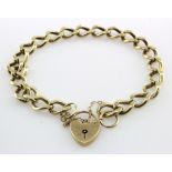 9ct yellow gold curb link charm bracelet with padlock clasp and safety chain, length 20.5cm,